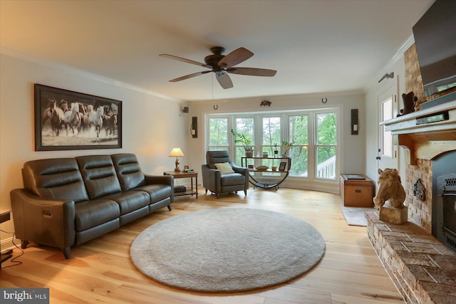 1715 Mountain View Rd, Harrisburg, PA 17110 - living room with ornamental molding, a ceiling fan, light wood finished floors, and a wood stove