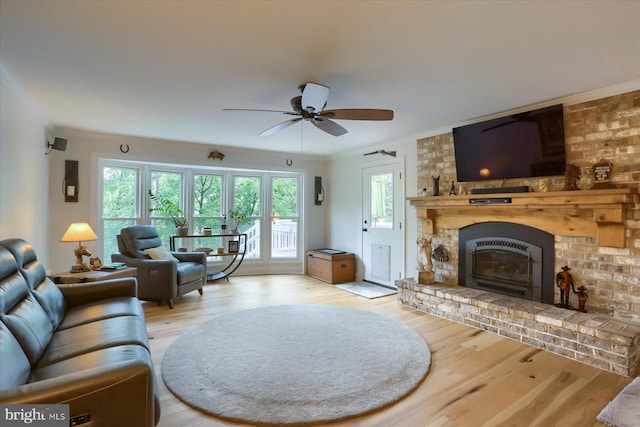 1715 Mountain View Rd, Harrisburg, PA 17110 - living area with wood finished floors, a fireplace, crown molding, and ceiling fan