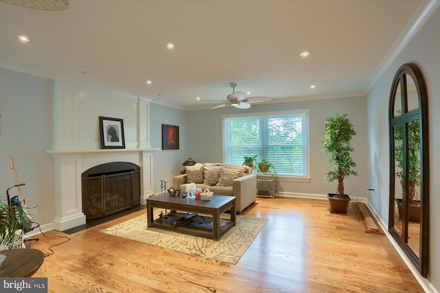 1715 Mountain View Rd, Harrisburg, PA 17110 - living area with light wood-style flooring, ornamental molding, a fireplace with flush hearth, recessed lighting, and ceiling fan