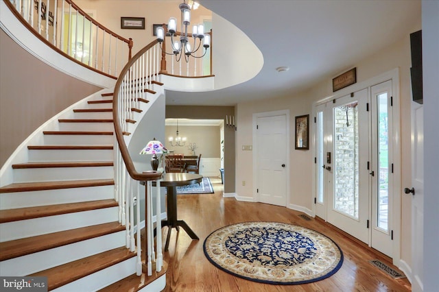 1715 Mountain View Rd, Harrisburg, PA 17110 - foyer with a chandelier, wood finished floors, stairway, and healthy amount of natural light