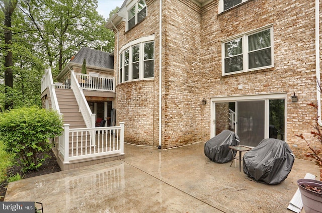 1715 Mountain View Rd, Harrisburg, PA 17110 - back of house with stairway, brick siding, a patio area, and a wooden deck