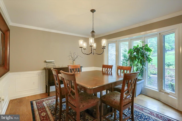 1715 Mountain View Rd, Harrisburg, PA 17110 - dining space featuring wood finished floors, crown molding, a chandelier, and wainscoting
