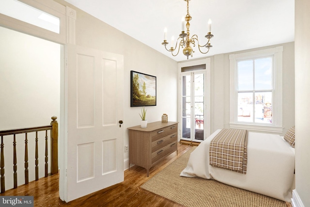 812 E St SE, Washington, DC 20003 - bedroom with a chandelier, dark wood-style flooring, access to exterior, and baseboards