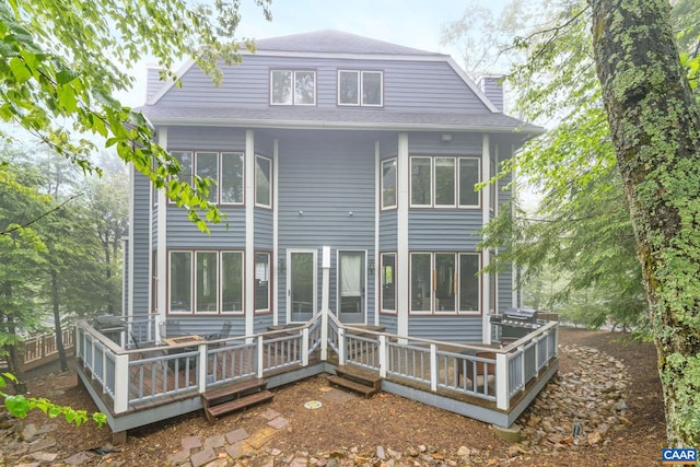 23 Trillium Close, Wintergreen Resort, VA 22967 - back of property featuring a chimney, a wooden deck, and a shingled roof
