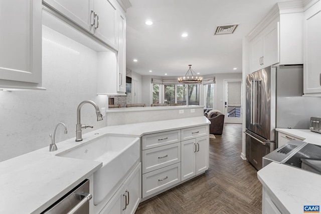 23 Trillium Close, Wintergreen Resort, VA 22967 - kitchen with recessed lighting, white cabinets, stainless steel dishwasher, decorative backsplash, and pendant lighting