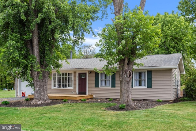 ranch-style home with a front lawn, a garage, crawl space, and roof with shingles