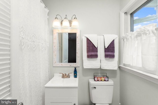 full bathroom featuring vanity and toilet