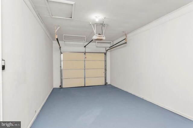 garage featuring a garage door opener and baseboards