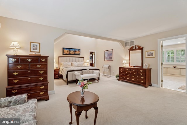 20 Dorchester Way, Phoenixville, PA 19460 - bedroom with light carpet, baseboards, ensuite bath, and lofted ceiling