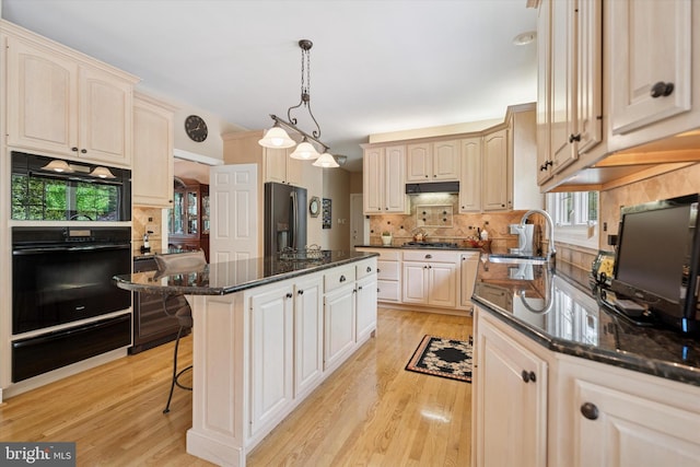 20 Dorchester Way, Phoenixville, PA 19460 - kitchen featuring a sink, fridge with ice dispenser, a warming drawer, light wood finished floors, and tasteful backsplash