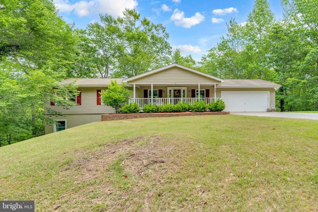 463 Bronco Trl, Lusby, MD 20657 - single story home featuring a porch, driveway, a garage, and a front lawn