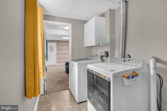 463 Bronco Trl, Lusby, MD 20657 - laundry room featuring cabinet space, separate washer and dryer, light tile patterned flooring, and light colored carpet