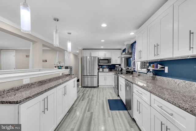 463 Bronco Trl, Lusby, MD 20657 - kitchen with stainless steel appliances, wall chimney exhaust hood, white cabinetry, recessed lighting, and ornamental molding