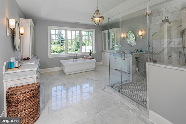 280 Carter Rd, Princeton, NJ 08540 - bathroom with vanity, a stall shower, a freestanding tub, baseboards, and marble finish floors