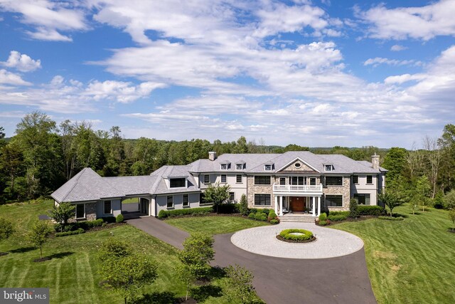 280 Carter Rd, Princeton, NJ 08540 - view of front facade featuring curved driveway, a chimney, a front yard, and stone siding