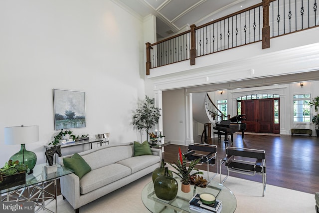 280 Carter Rd, Princeton, NJ 08540 - living area featuring stairs, wood finished floors, a high ceiling, healthy amount of natural light, and crown molding