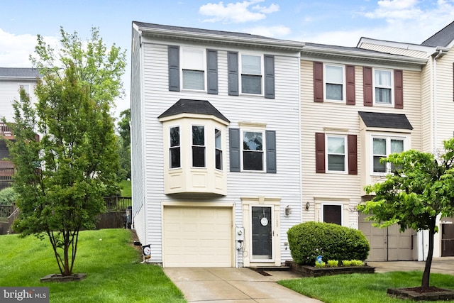 1129 Kelfield Dr Unit 1129, Baltimore, MD 21227 - multi unit property with an attached garage, concrete driveway, and a front lawn