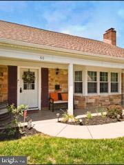 60 Windsor Ln, Willingboro, NJ 08046 - rear view of property with covered porch and a chimney