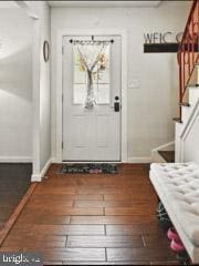 60 Windsor Ln, Willingboro, NJ 08046 - entryway with baseboards, stairs, and wood finished floors