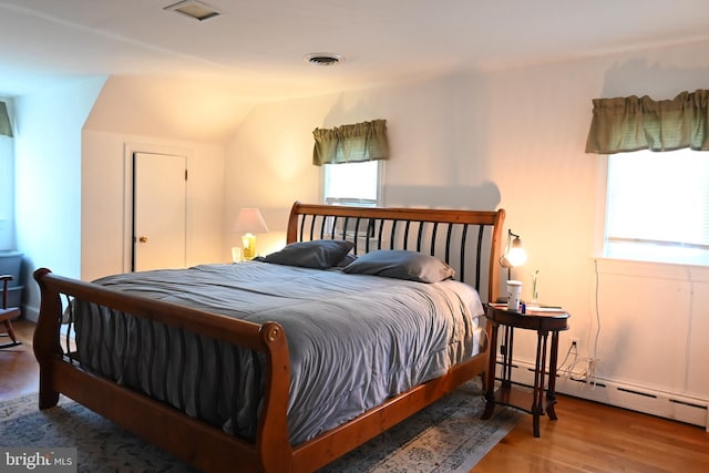9706 Fairway Dr, New Market, VA 22844 - bedroom featuring a baseboard radiator, lofted ceiling, and wood finished floors