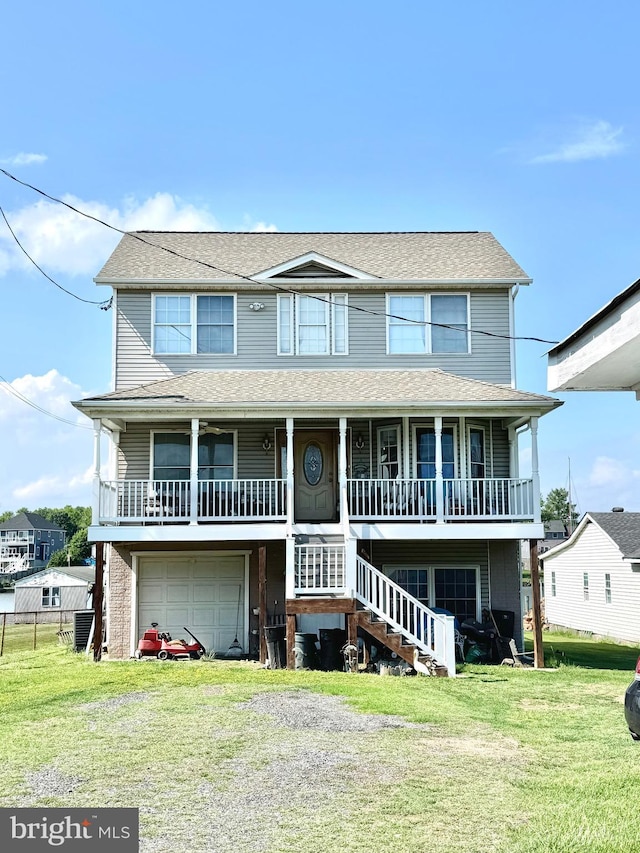 7226 Waldman Ave, Sparrows Point, MD 21219 - view of front of home with covered porch, a front lawn, a garage, and stairway