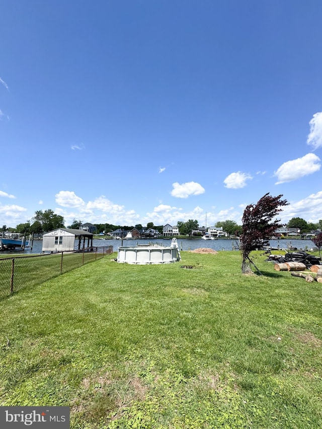 7226 Waldman Ave, Sparrows Point, MD 21219 - view of yard with a covered pool and a water view