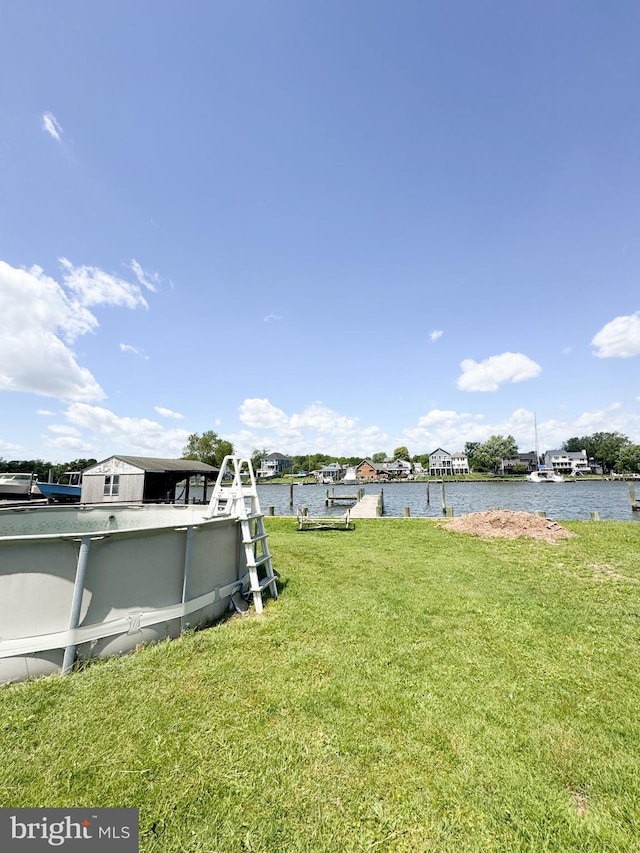 7226 Waldman Ave, Sparrows Point, MD 21219 - view of grassy yard with a water view and a boat dock
