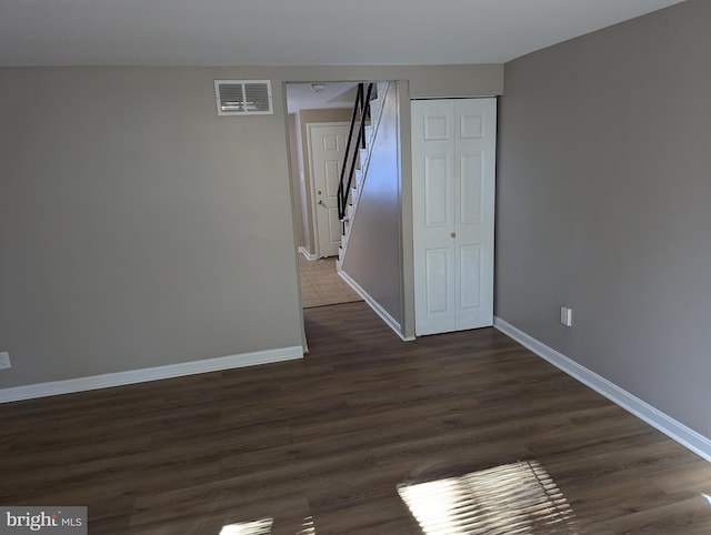 1026 Fredonia Ct, Baltimore, MD 21227 - spare room with baseboards and dark wood-style flooring