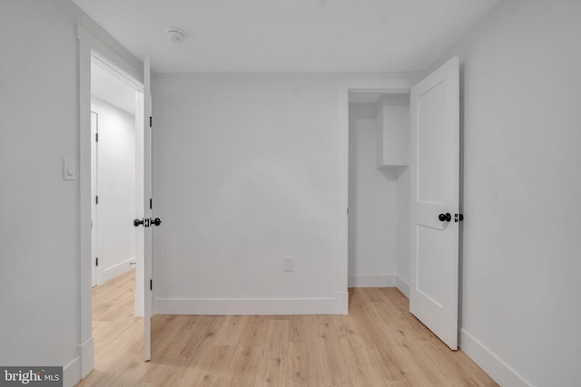 1636 40th St SE, Washington, DC 20020 - unfurnished bedroom with light wood-style flooring and baseboards
