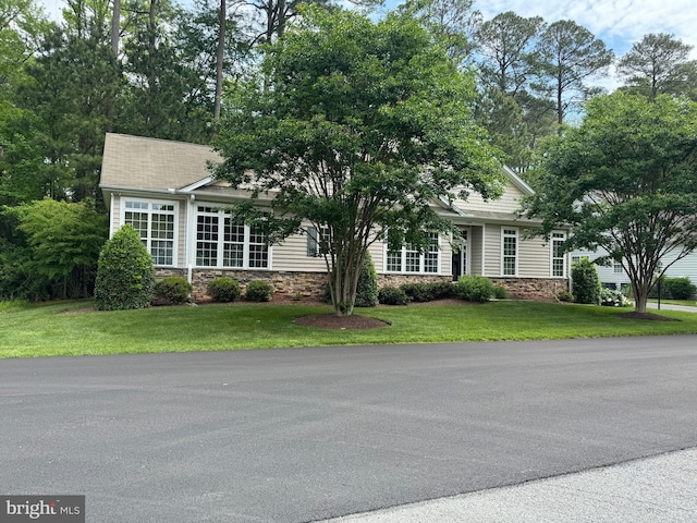 11625 Manklin Creek Rd, Ocean Pines, MD 21811 - view of property hidden behind natural elements featuring stone siding and a front yard