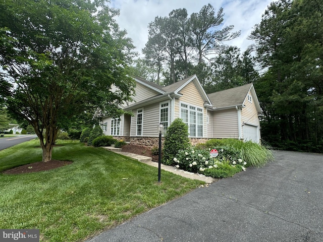 11625 Manklin Creek Rd, Ocean Pines, MD 21811 - view of home's exterior with a yard, asphalt driveway, and an attached garage