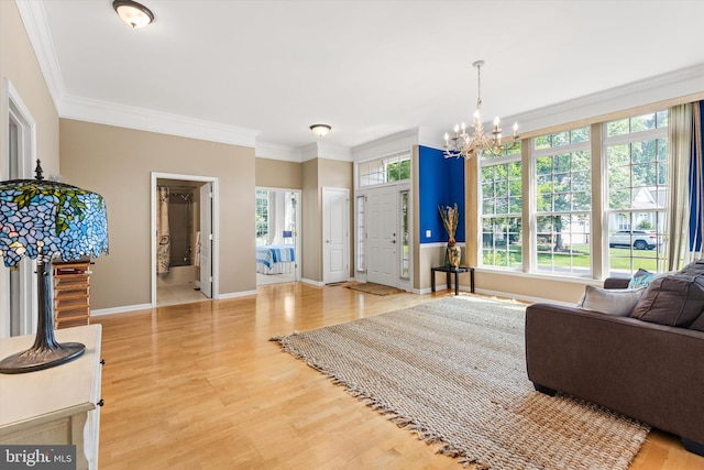 11625 Manklin Creek Rd, Ocean Pines, MD 21811 - living area featuring a chandelier, ornamental molding, and light wood-type flooring