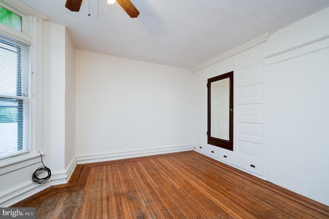 empty room with wood finished floors and ceiling fan