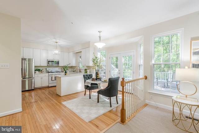 12221 Quadrille Ln, Bowie, MD 20720 - living area featuring baseboards, light wood finished floors, and french doors