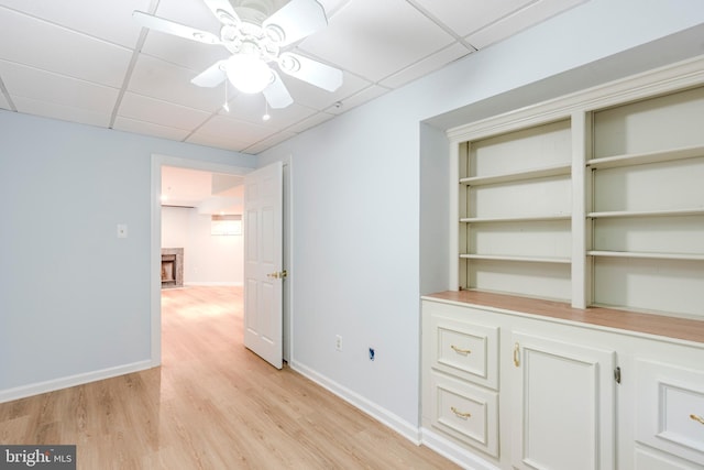 12221 Quadrille Ln, Bowie, MD 20720 - empty room featuring a drop ceiling, a ceiling fan, light wood finished floors, and baseboards