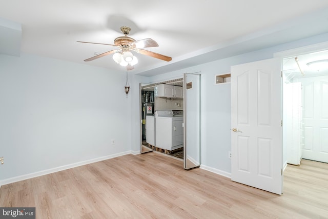 12221 Quadrille Ln, Bowie, MD 20720 - unfurnished bedroom featuring separate washer and dryer, light wood-type flooring, and baseboards