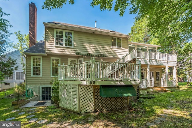 12221 Quadrille Ln, Bowie, MD 20720 - rear view of house with a chimney, a deck, and stairs