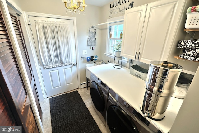 165 Wappler Dr, Hanover, PA 17331 - washroom featuring cabinet space, washing machine and clothes dryer, a chandelier, and a baseboard heating unit