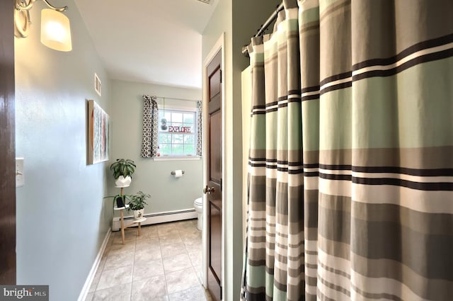 165 Wappler Dr, Hanover, PA 17331 - full bathroom with baseboard heating, toilet, baseboards, a shower with shower curtain, and tile patterned floors