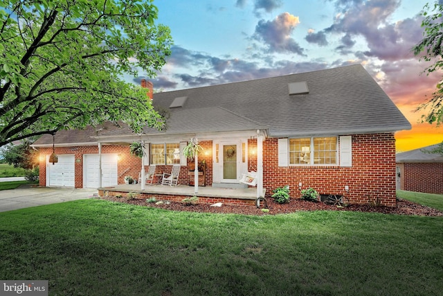 165 Wappler Dr, Hanover, PA 17331 - new england style home featuring a porch, an attached garage, brick siding, driveway, and a yard