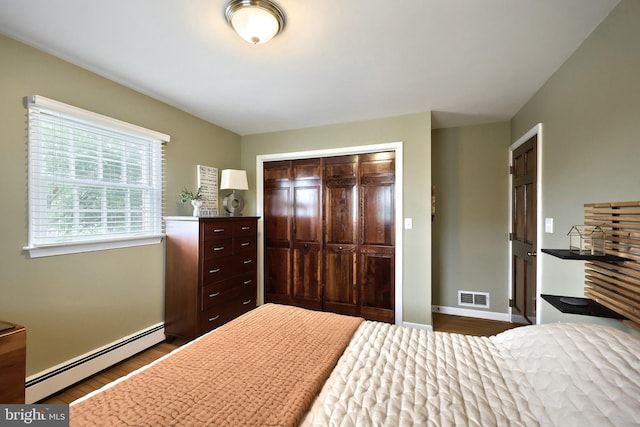 165 Wappler Dr, Hanover, PA 17331 - bedroom featuring a baseboard radiator, a closet, dark wood-style flooring, and baseboards