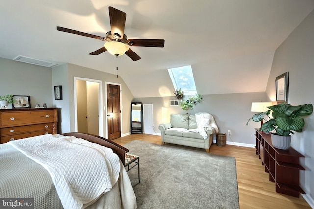 165 Wappler Dr, Hanover, PA 17331 - bedroom with light wood-style flooring, vaulted ceiling, baseboards, a skylight, and ceiling fan