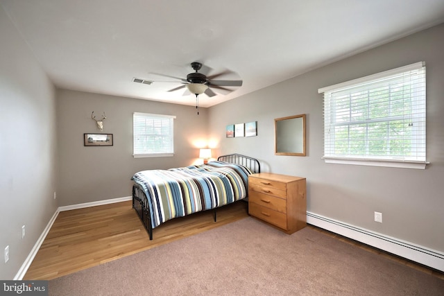 165 Wappler Dr, Hanover, PA 17331 - bedroom featuring baseboard heating, baseboards, light wood-type flooring, and a ceiling fan