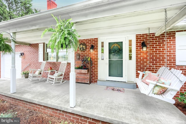 165 Wappler Dr, Hanover, PA 17331 - doorway to property with a porch, brick siding, and a chimney
