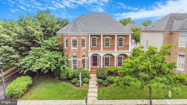 710 Crisfield Way, Annapolis, MD 21401 - view of front facade featuring brick siding, a front lawn, a porch, and roof with shingles