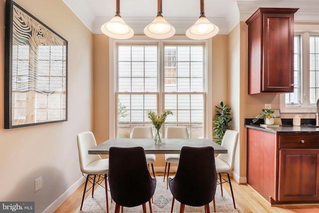 710 Crisfield Way, Annapolis, MD 21401 - dining space with ornamental molding, light wood-style floors, and baseboards