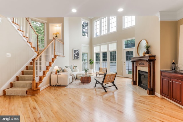 710 Crisfield Way, Annapolis, MD 21401 - living room with light wood-style floors, stairway, recessed lighting, a towering ceiling, and ornamental molding