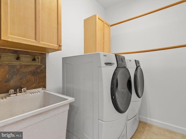 710 Crisfield Way, Annapolis, MD 21401 - clothes washing area with cabinet space, washer and dryer, light tile patterned floors, and baseboards