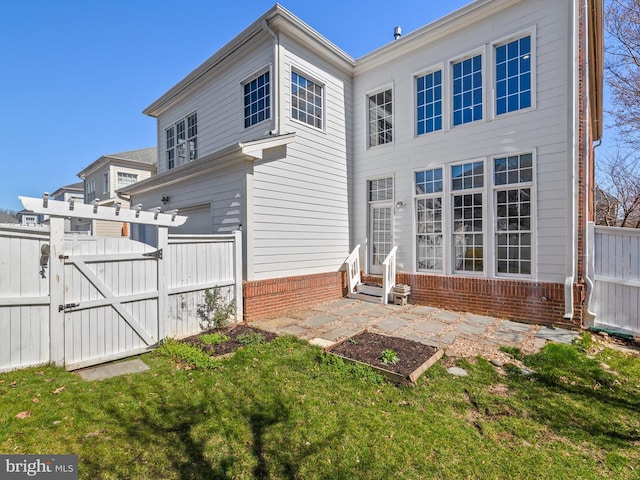 710 Crisfield Way, Annapolis, MD 21401 - back of property featuring brick siding, a gate, and entry steps
