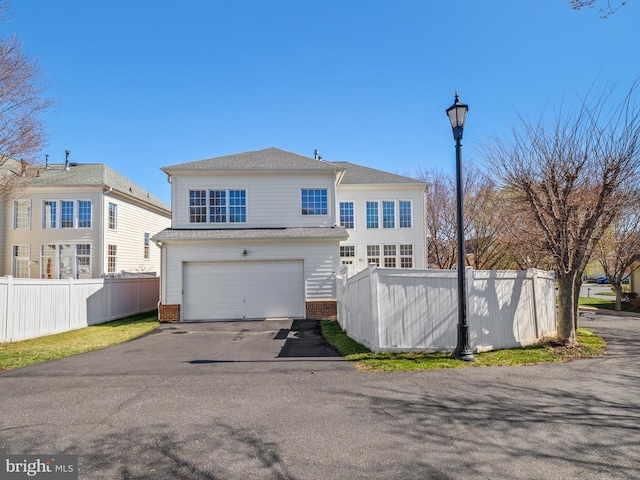 710 Crisfield Way, Annapolis, MD 21401 - view of front of house with fence, brick siding, driveway, and a garage